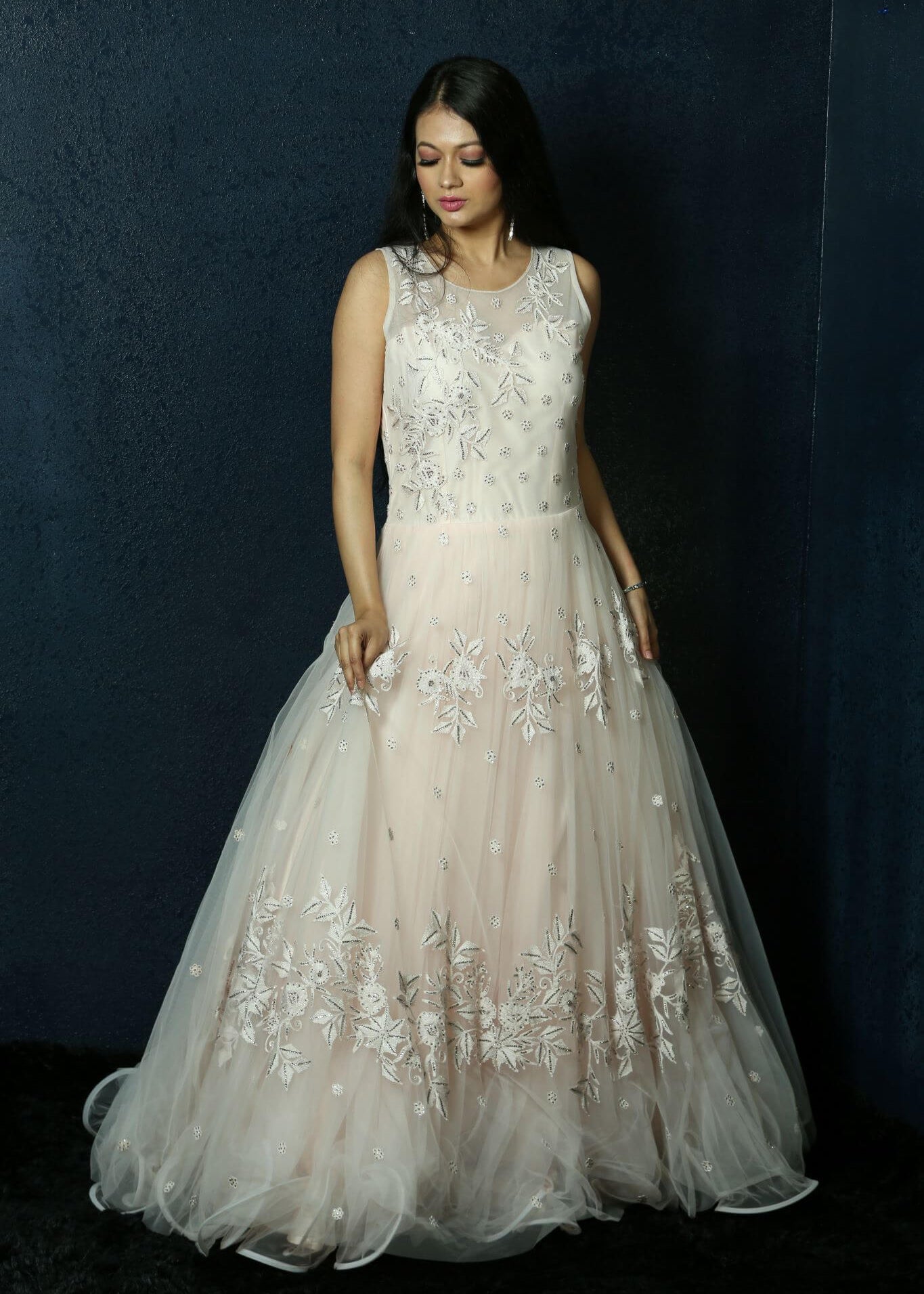Light Pink Net gown adorned with Swarovski work