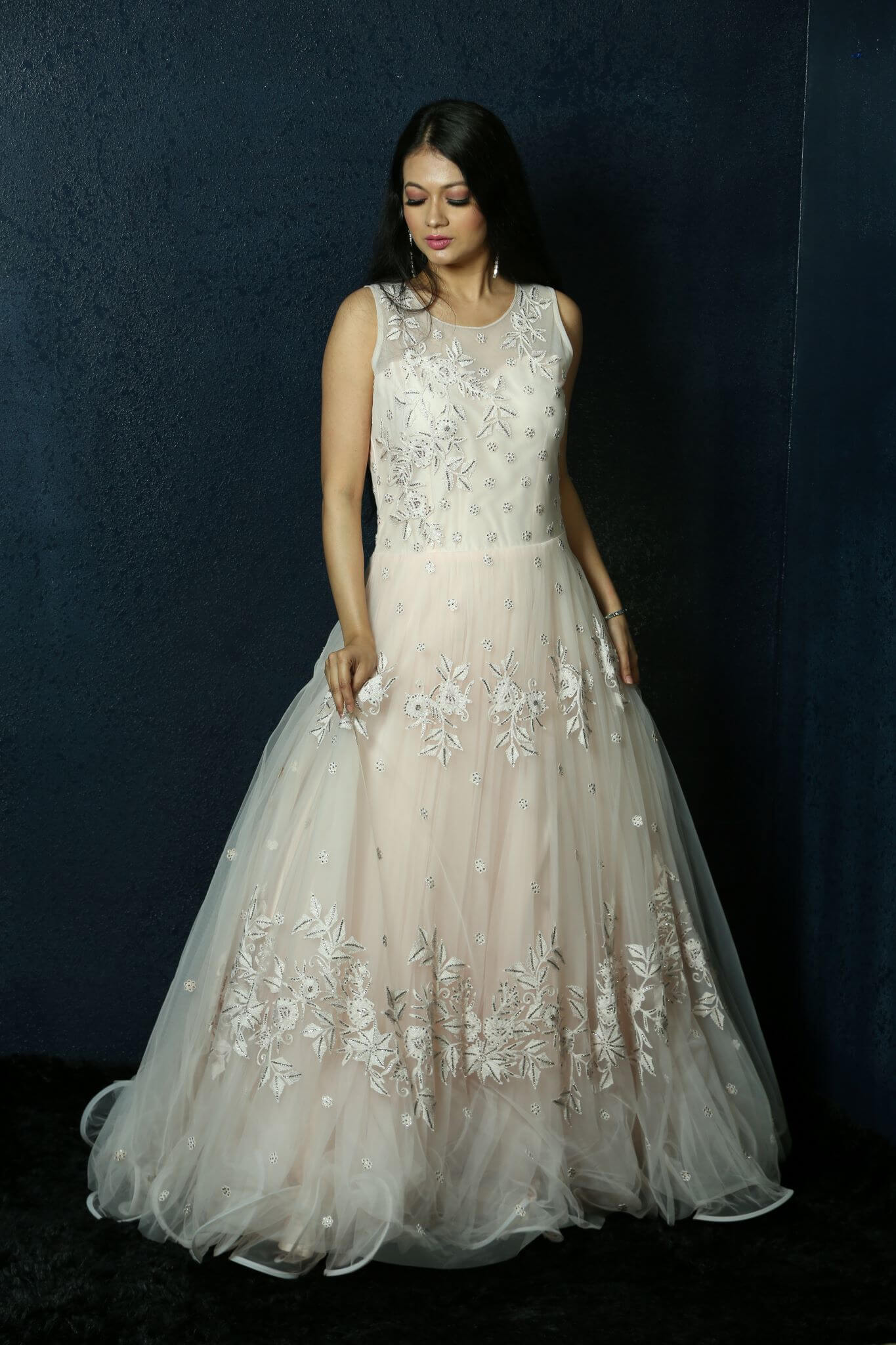 Light Pink Net gown adorned with Swarovski work