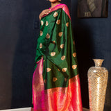 Green Katan Banarasi Silk Saree Embellished with Golden Floral Motifs and Pink Border - Anvi Couture