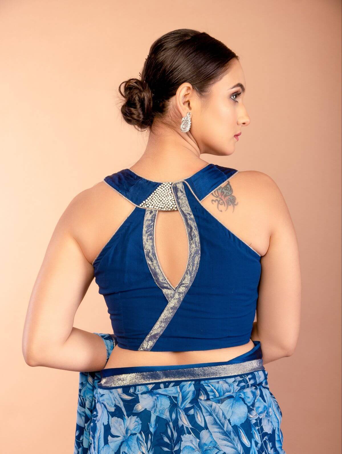 Back view of blue floral georgette saree showing draped pallu and blouse - Anvi Couture