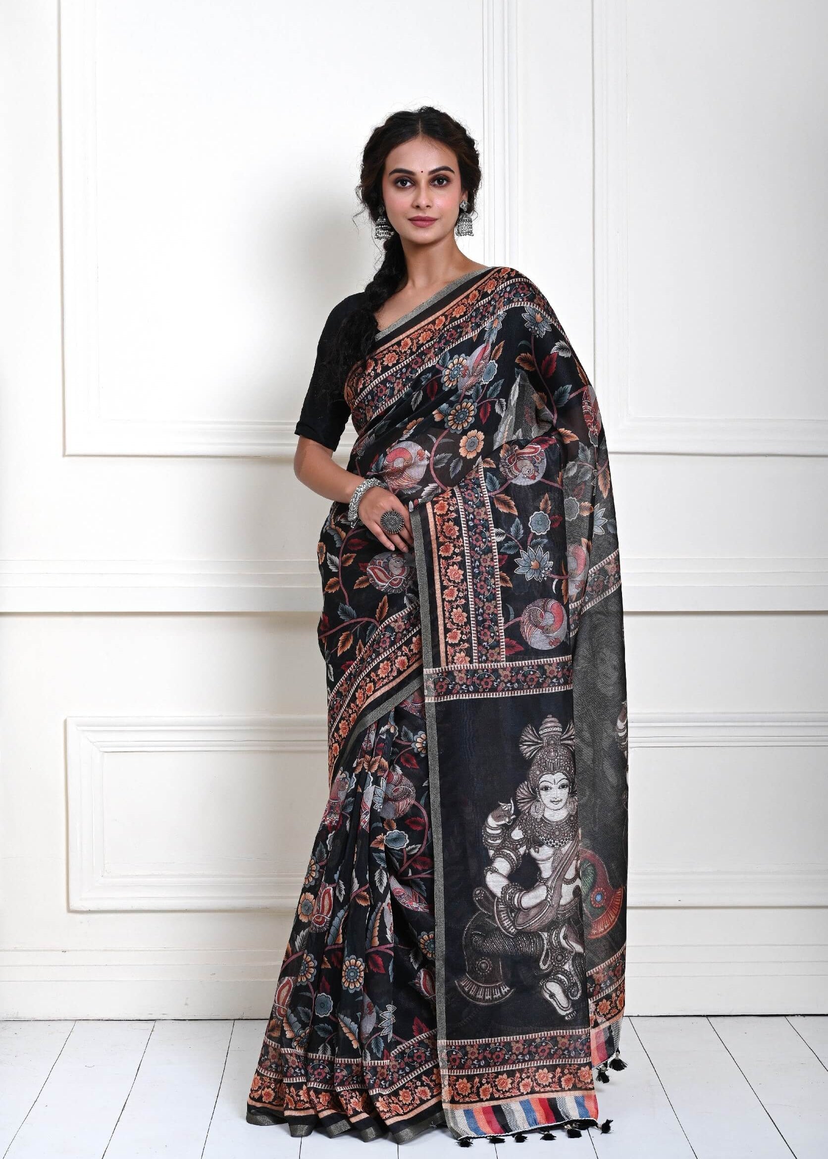 Black Kalamkari printed saree with traditional motifs in cotton silk