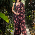 Black georgette saree with rose prints and stone embellishment — front drape view, Anvi Couture