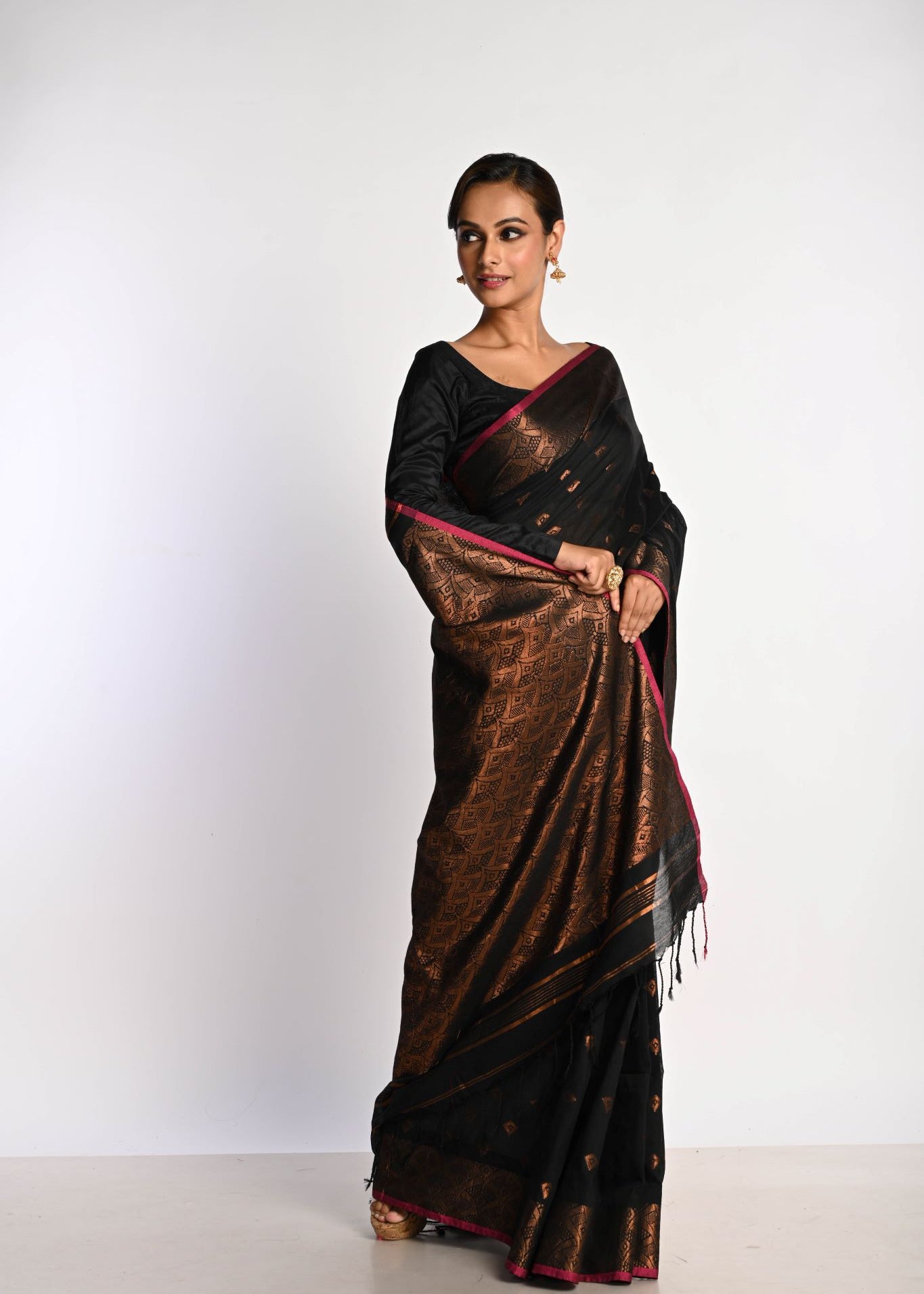 Black party wear saree with intricate golden zari Jamdani weave