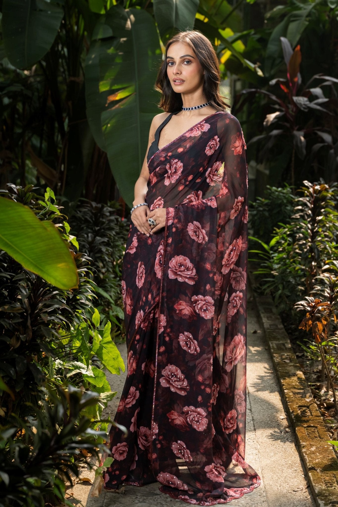 Black rose-print georgette saree — side view showing stone embellishment detail, Anvi Couture
