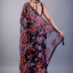 Black saree blouse design paired with sheer tissue party wear saree