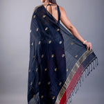 Black saree blouse paired with red ombre Tant Jamdani party wear - Back