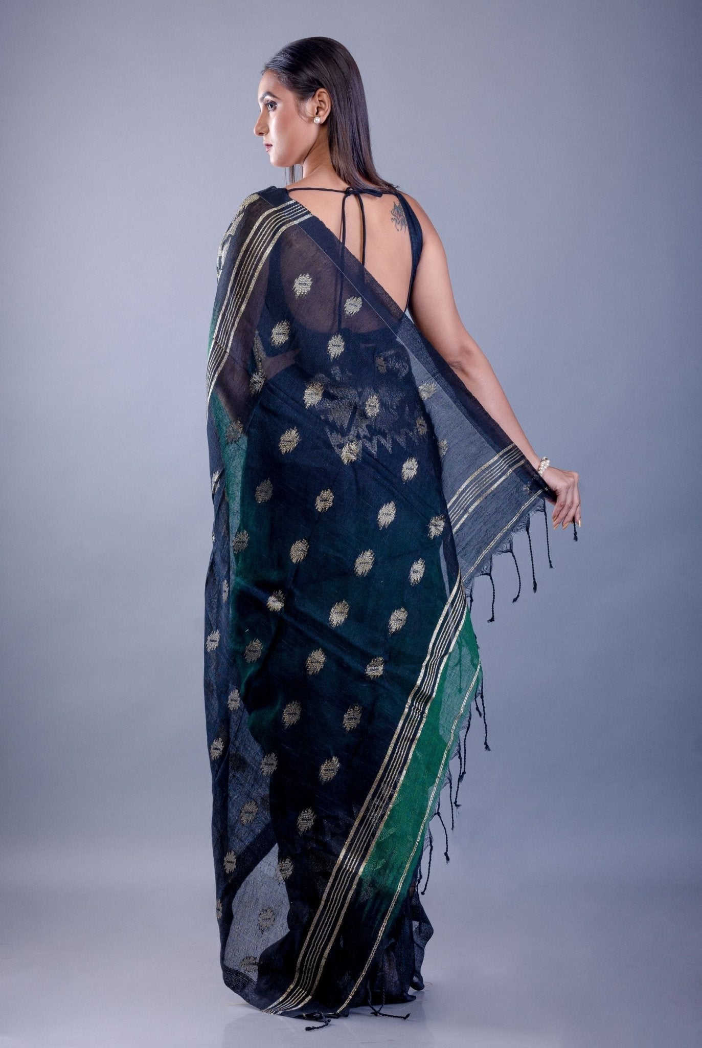 Black saree blouse styled with dark green ombre Tant Jamdani