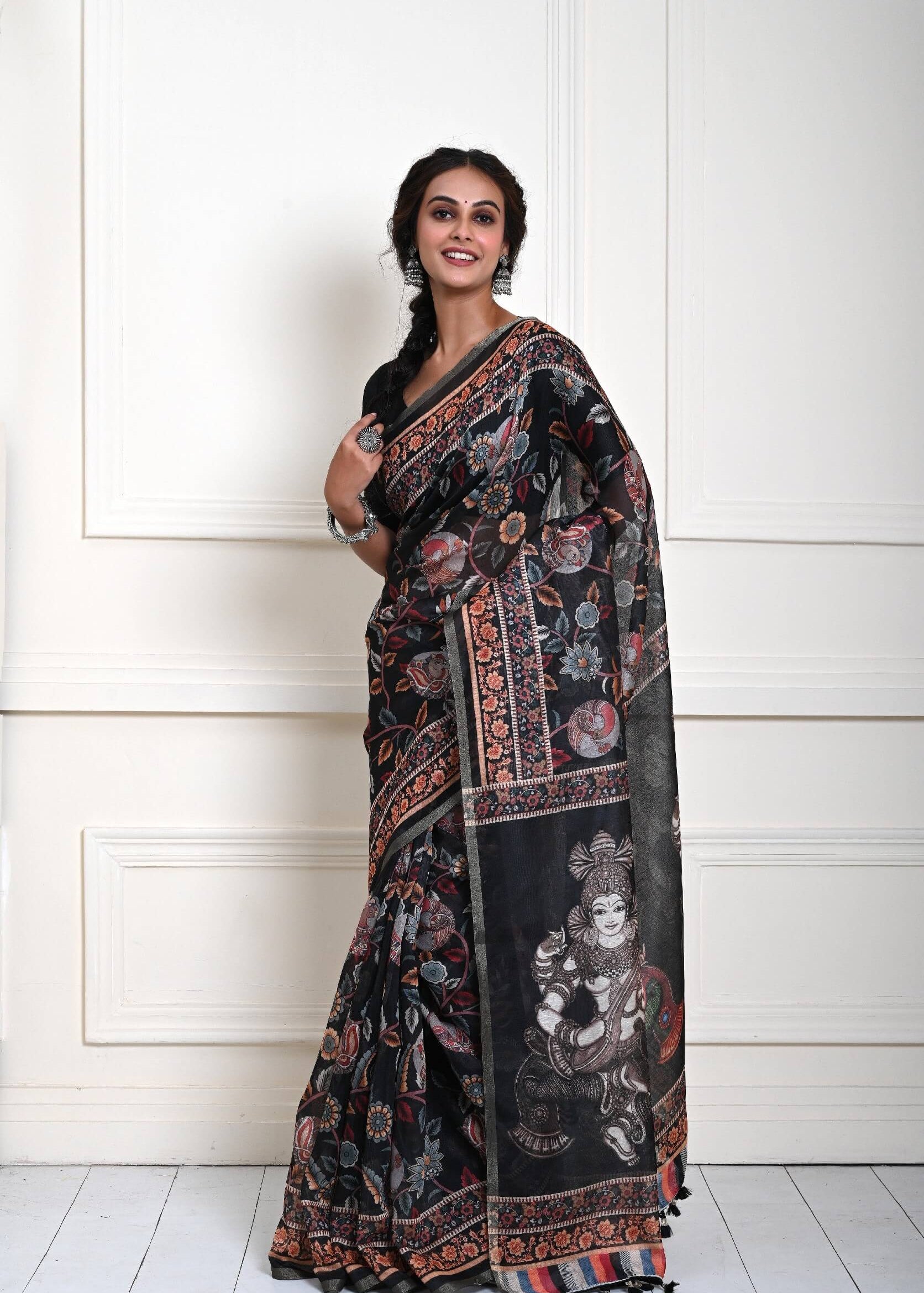 Black saree blouse styled with printed Kalamkari cotton silk drape