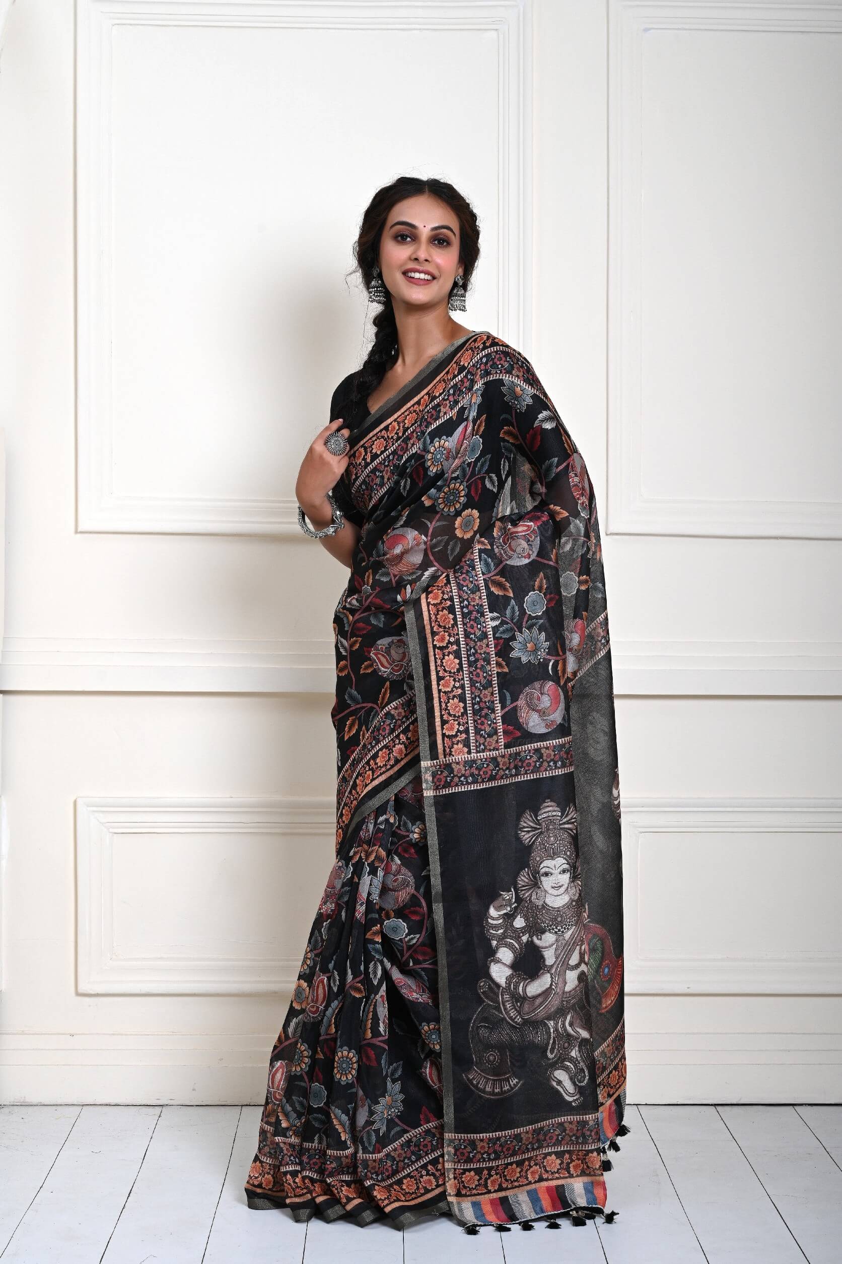 Black saree blouse styled with printed Kalamkari cotton silk drape