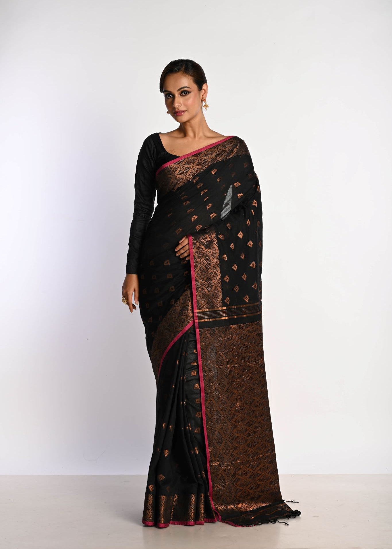 Black saree look in handwoven Jamdani with gold zari border