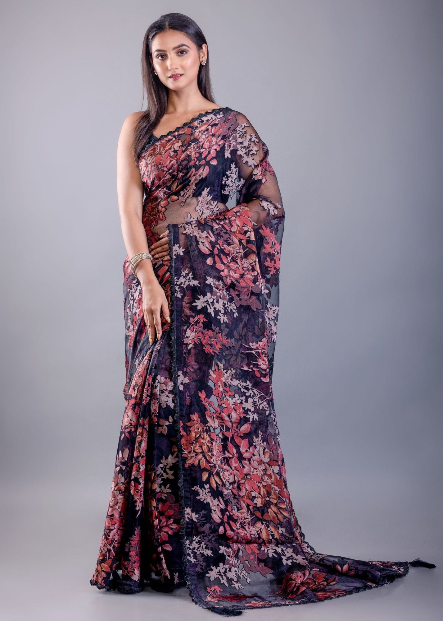 Black tissue silk saree look with floral print and elegant drape