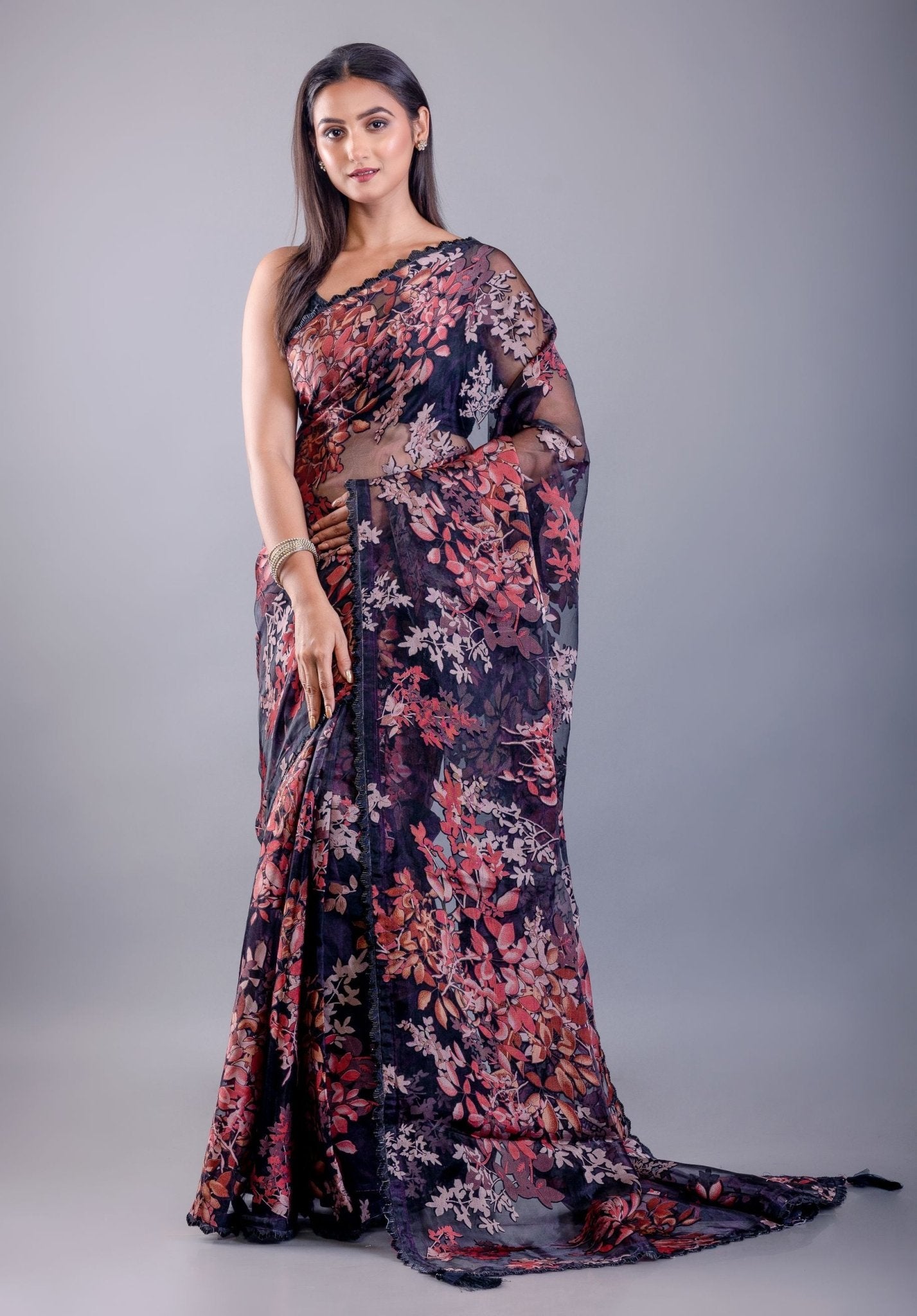 Black tissue silk saree look with floral print and elegant drape