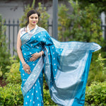 Blue Silk Banarasi Saree with Silver Floral Motifs and Matching Unstitched Blouse - Anvi Couture