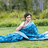 Blue Silk Banarasi Saree with Silver Floral Motifs and Matching Unstitched Blouse - Anvi Couture