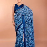 Blue floral printed georgette saree with matching blouse set — full-length front view