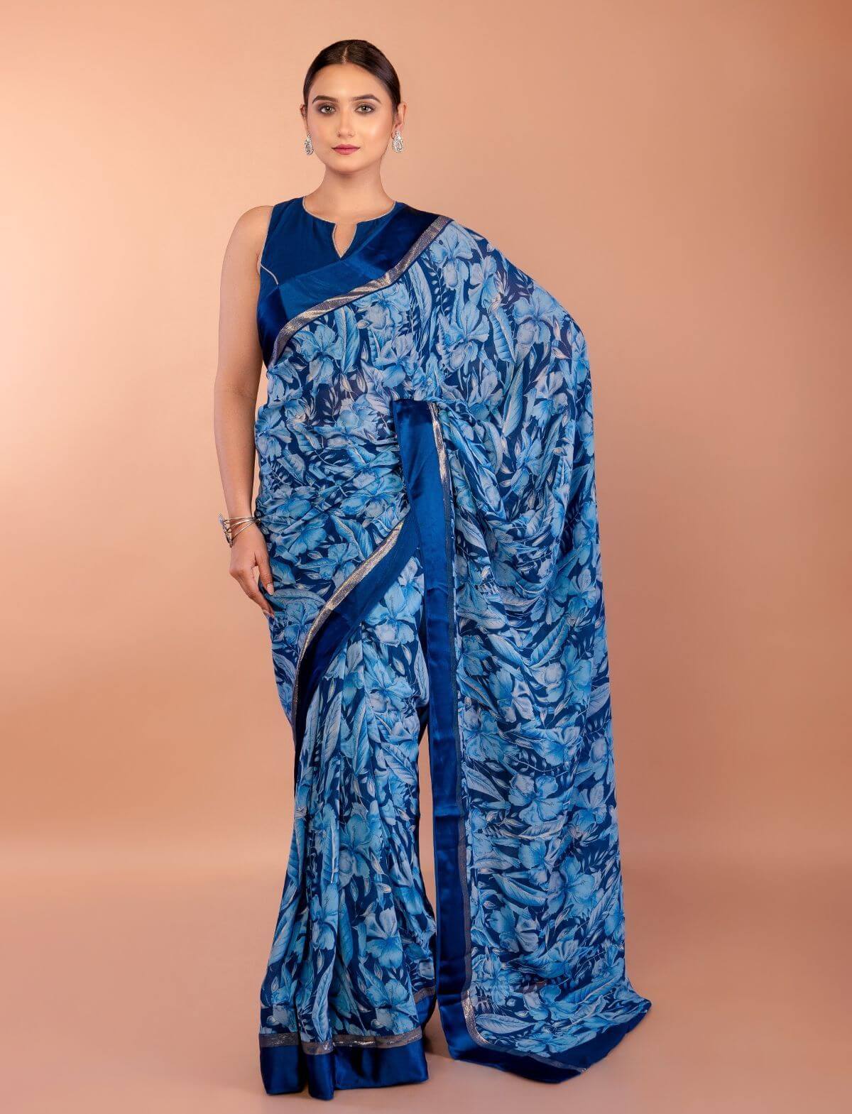 Blue floral printed georgette saree with matching blouse set — full-length front view