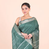 Bottle Green Silk Handloom Saree With Silver Woven Border Close Up View