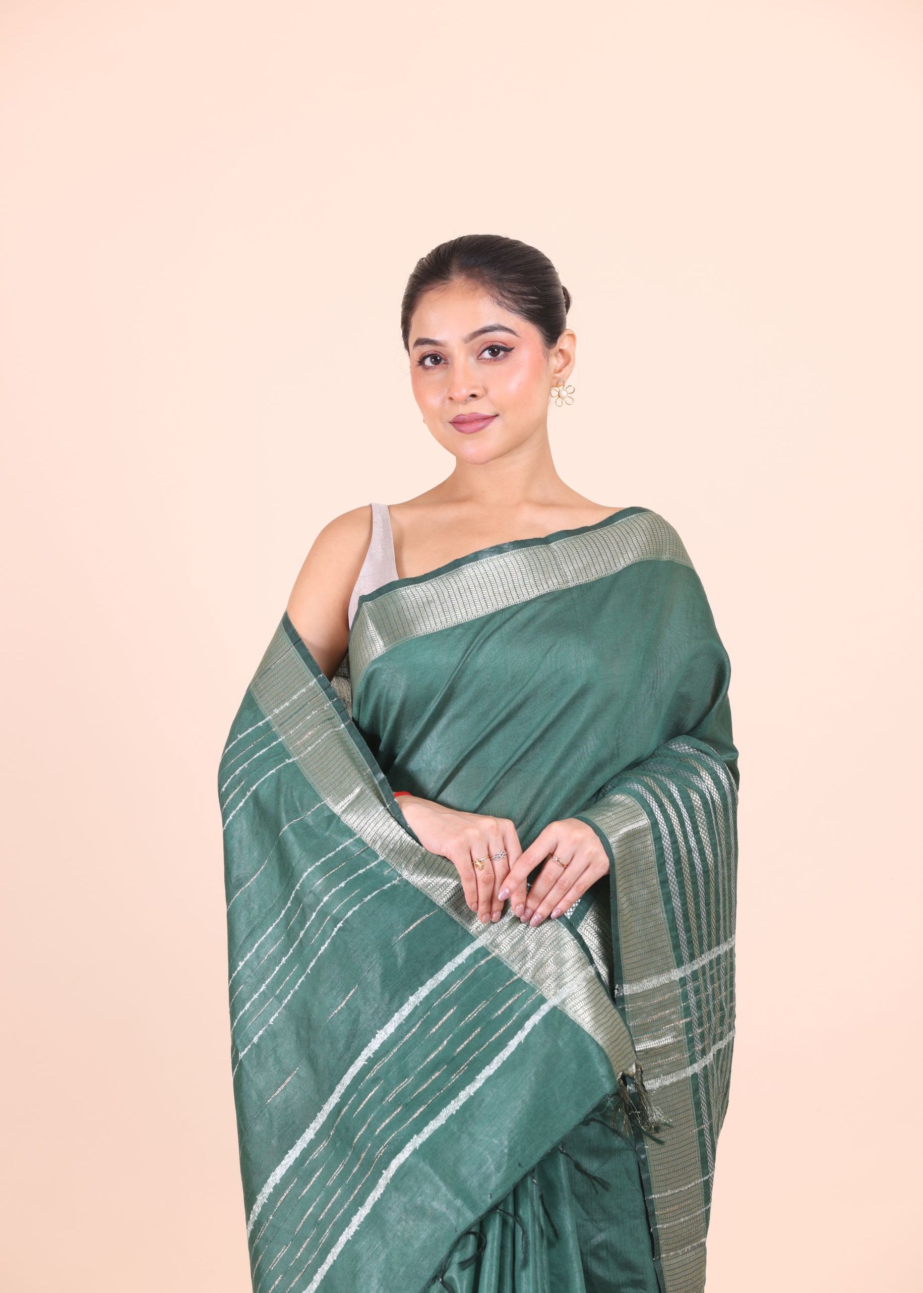 Bottle Green Silk Handloom Saree With Silver Woven Border Close Up View