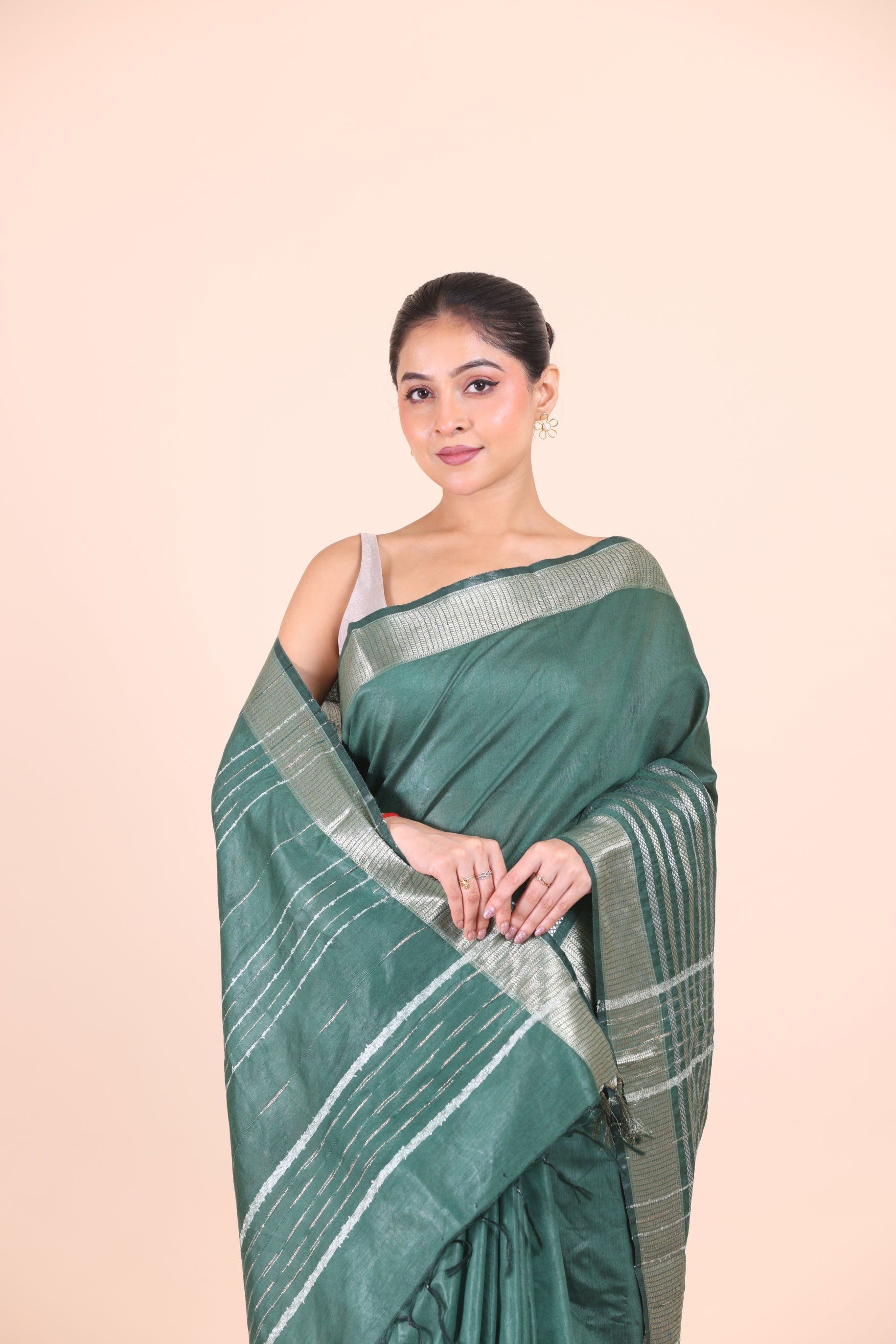 Bottle Green Silk Handloom Saree With Silver Woven Border Close Up View