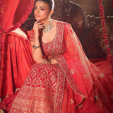 Bright Red Wedding Lehenga with Heavy Embroidered Work sitting side