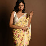 Butter Yellow Georgette Saree with Floral Prints and Pearl Border - Anvi Couture