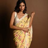 Butter Yellow Georgette Saree with Floral Prints and Pearl Border - Anvi Couture