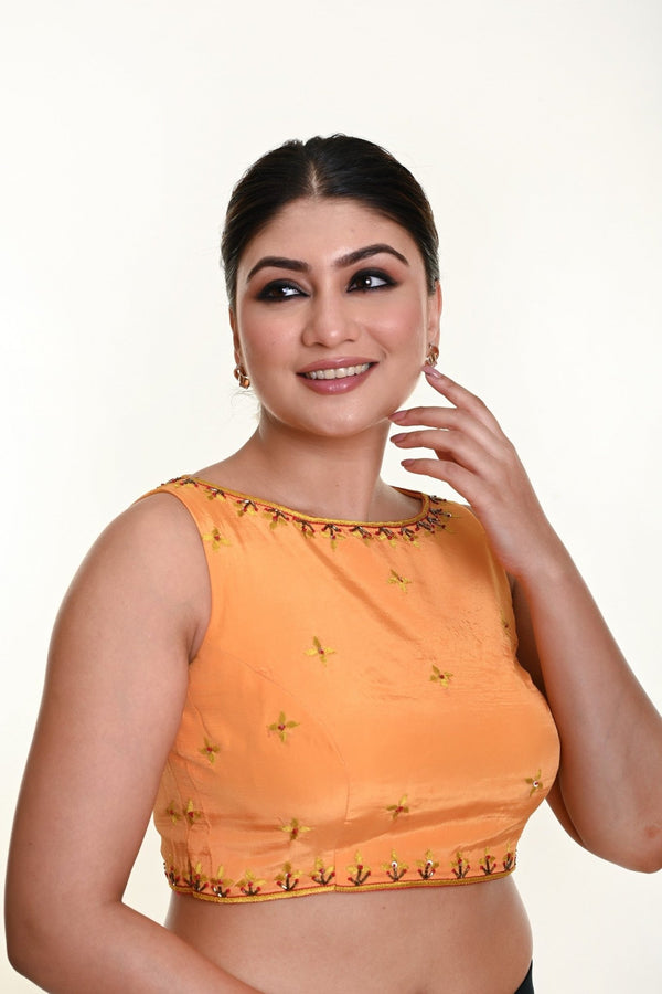 Butter yellow crepe silk sleeveless boat neck blouse with hand embroidery — front view