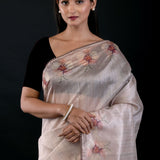 Close-up of floral embroidery detail on pearl white tissue silk saree, Anvi Couture - Front 3