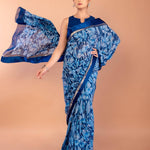 Close-up of multicolor floral print on blue georgette saree fabric