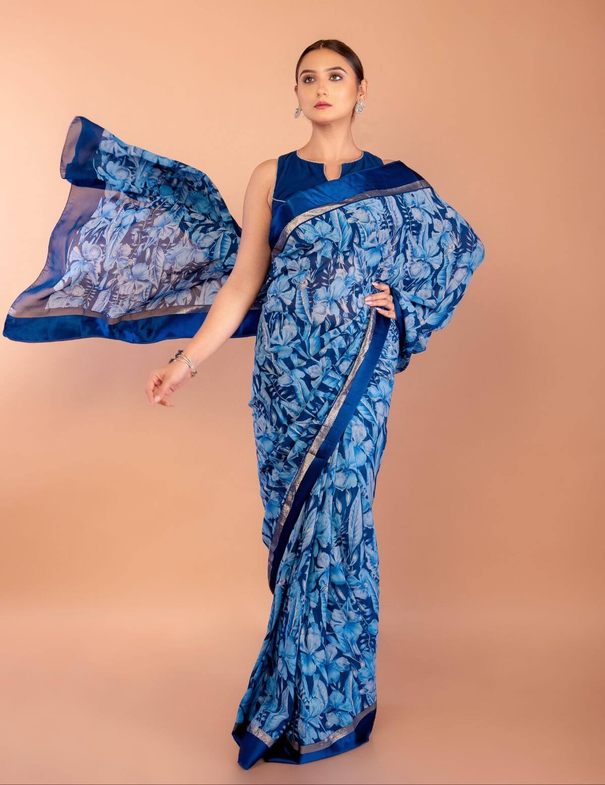 Close-up of multicolor floral print on blue georgette saree fabric