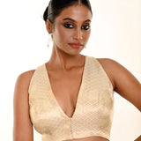 Close-up of pearl white brocade weave and V-neckline edge