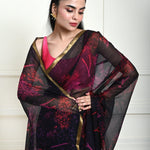 Close-up of printed pattern on dark navy blue chiffon saree