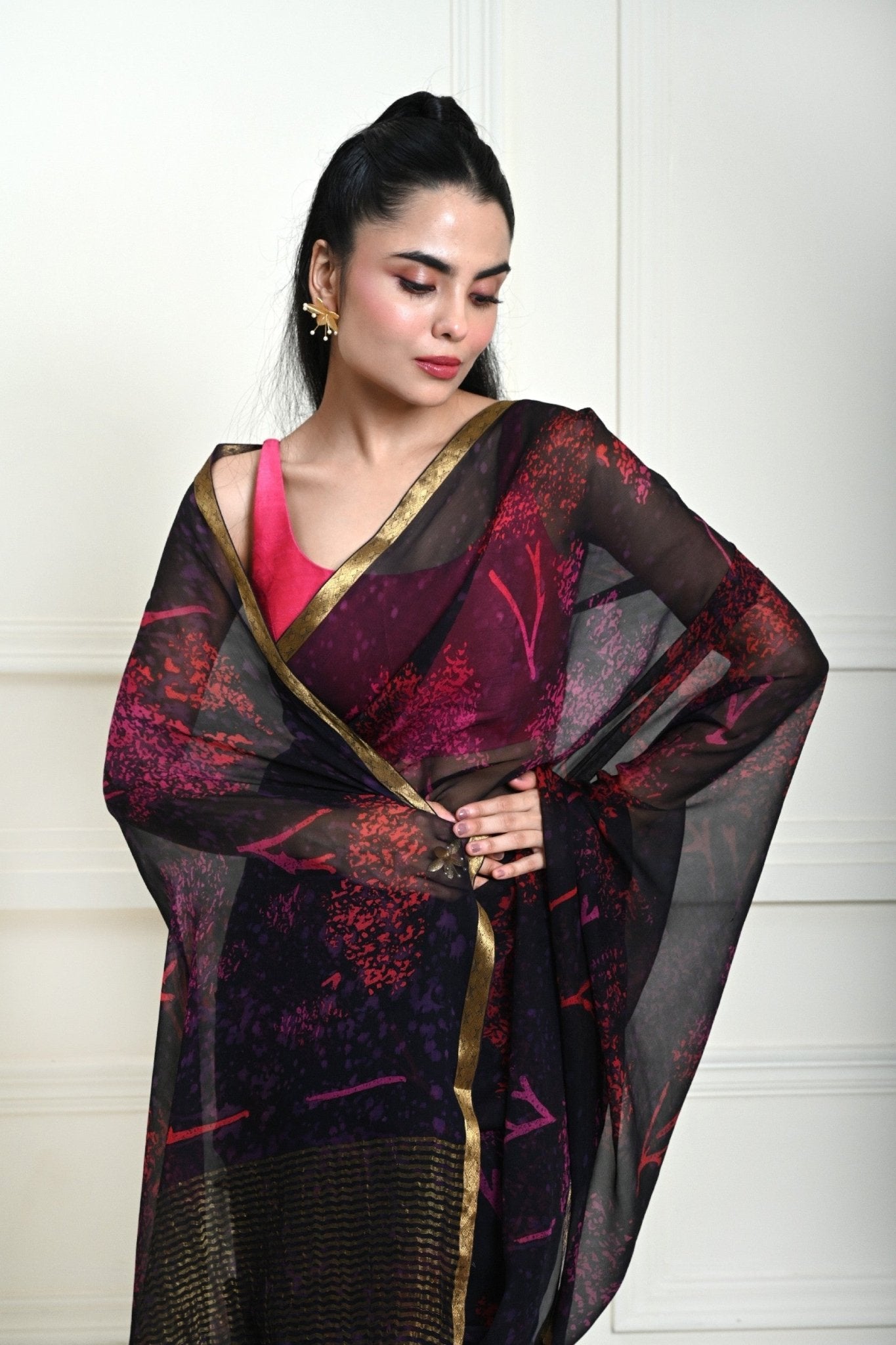 Close-up of printed pattern on dark navy blue chiffon saree