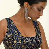 Close-up of square neckline and woven brocade texture
