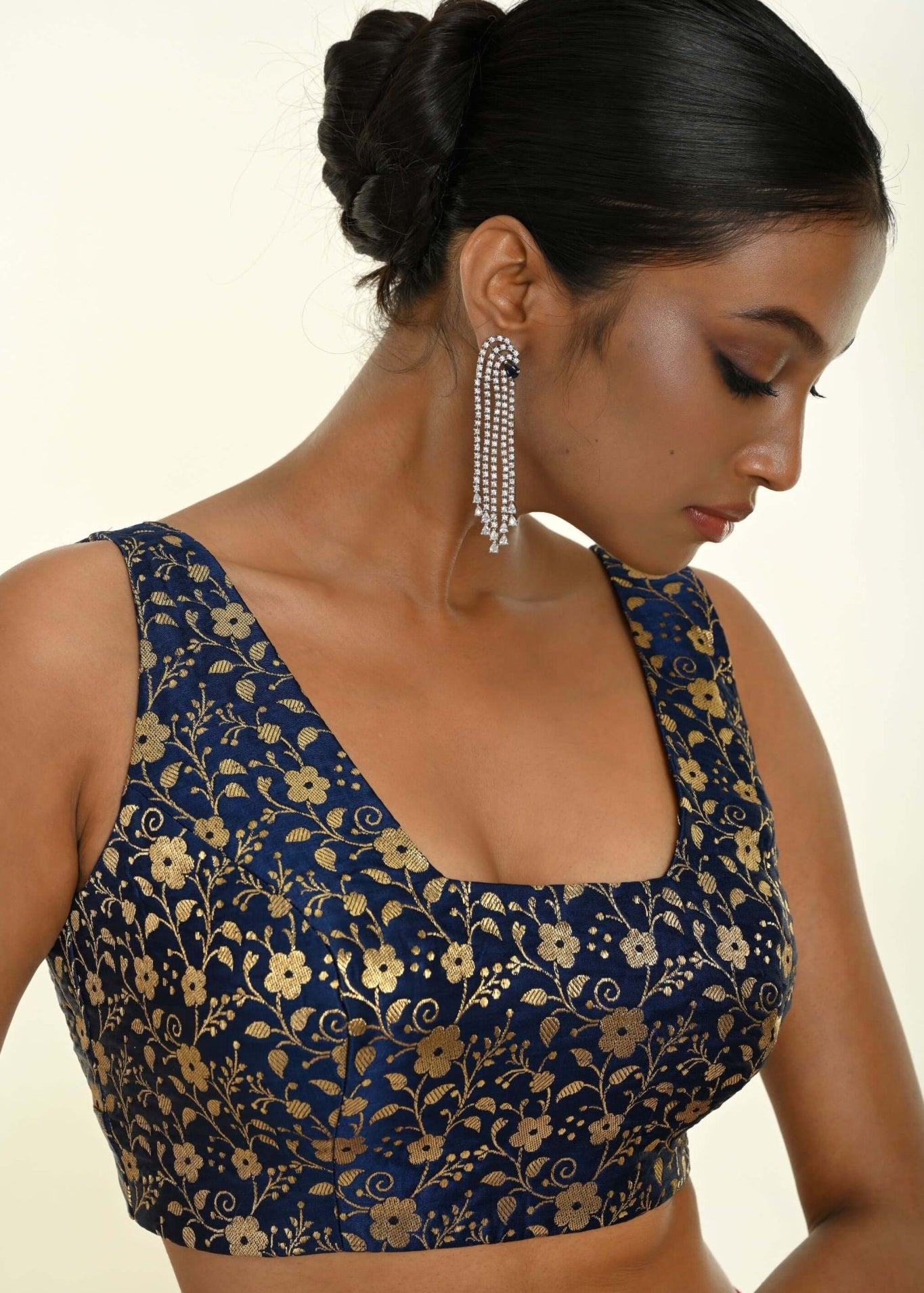 Close-up of square neckline and woven brocade texture