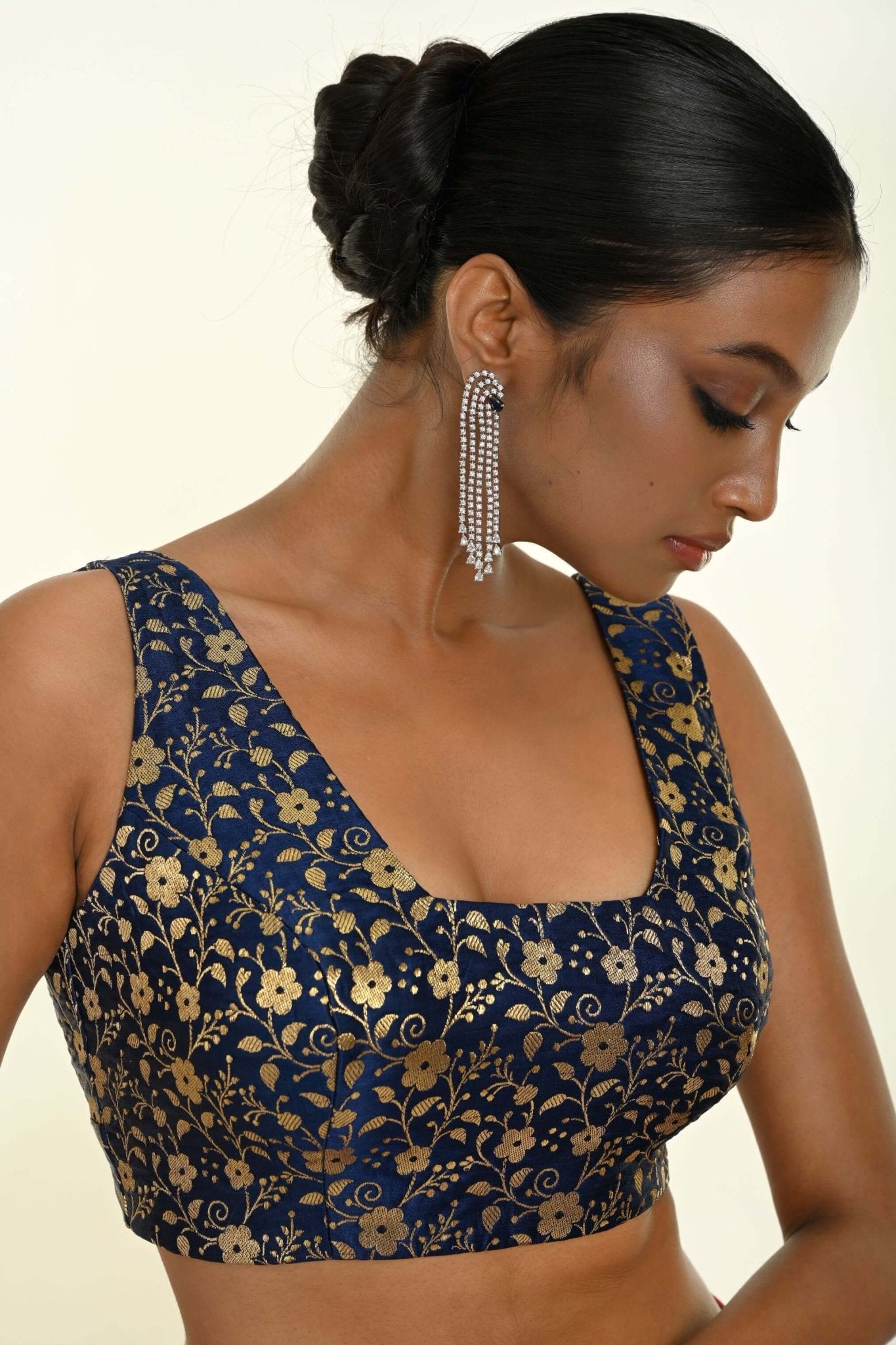 Close-up of square neckline and woven brocade texture