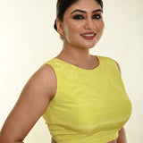 Close-up of the back bow tie on lemon yellow satin sleeveless blouse