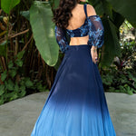 Coastal blue ombre lehenga — back view of full ombre skirt drape with designer crop top