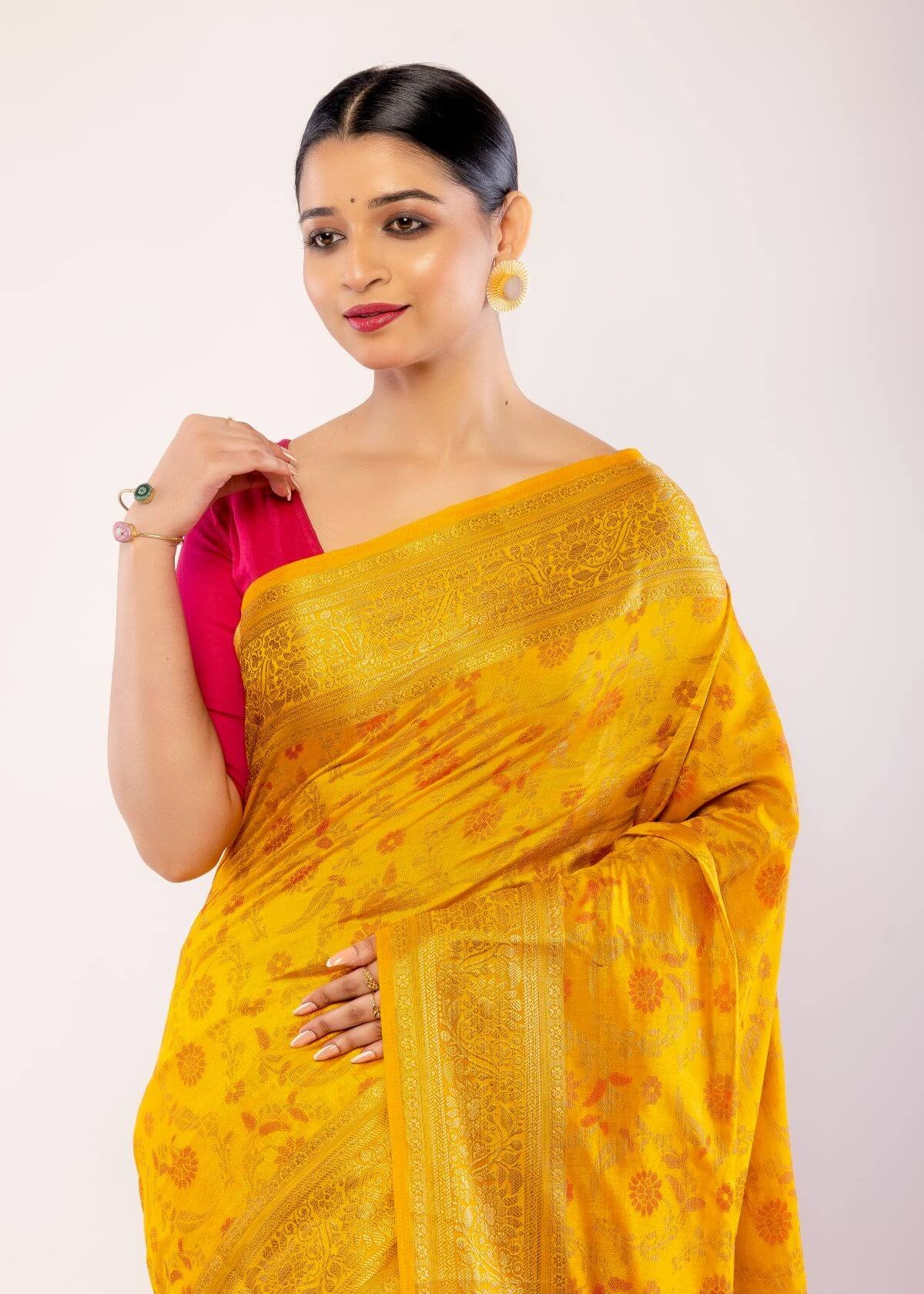 Yellow Art Silk Saree with Gold Zari Border and Orange Floral Motifs - Anvi Couture