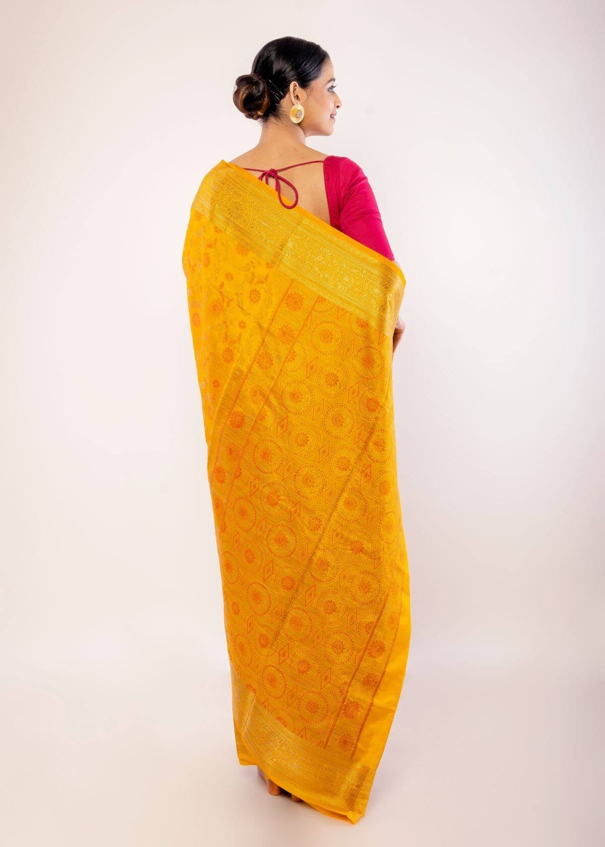 Yellow Art Silk Saree with Gold Zari Border and Orange Floral Motifs - Anvi Couture