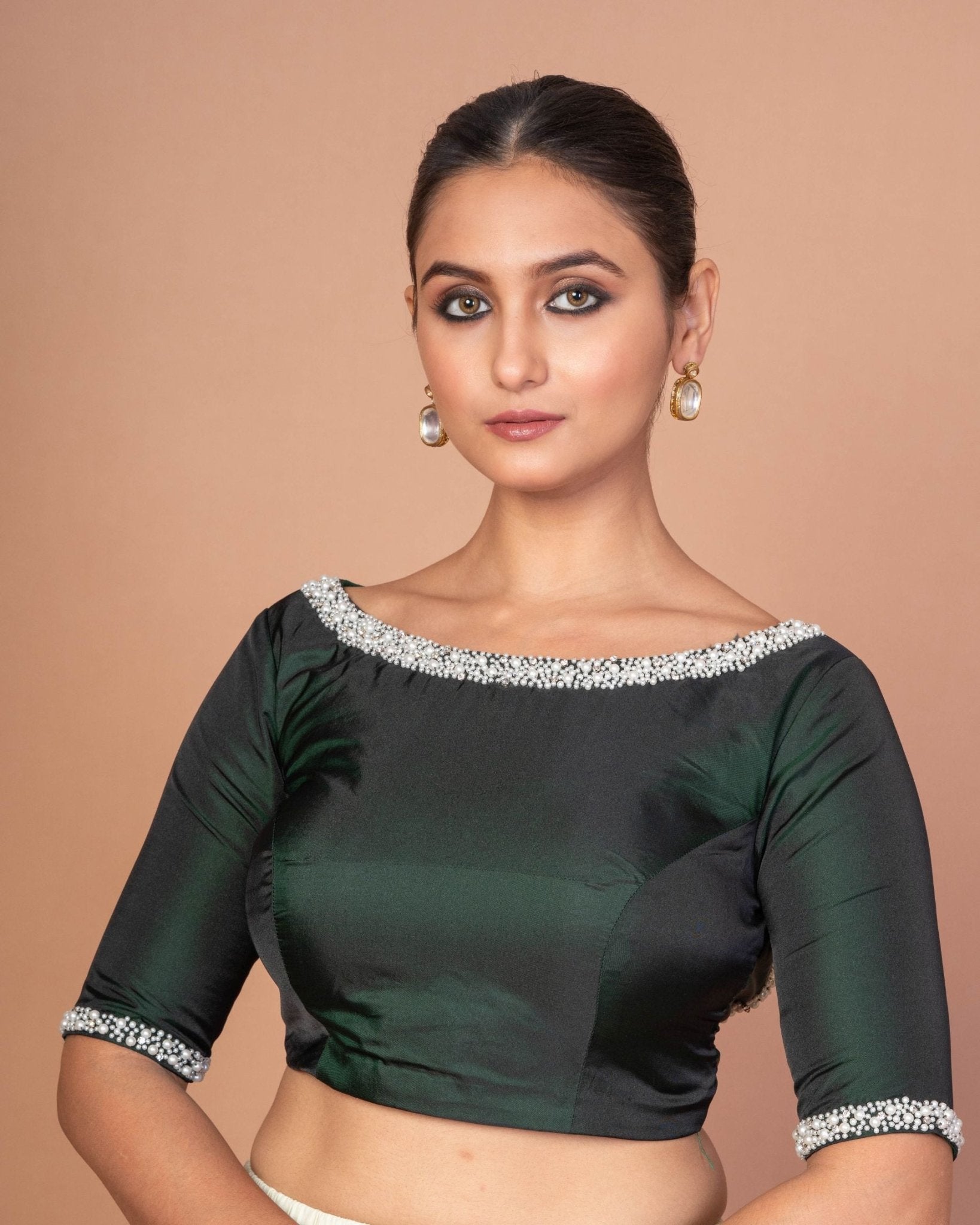 Dark green hand-embroidered silk boat neck blouse — front view