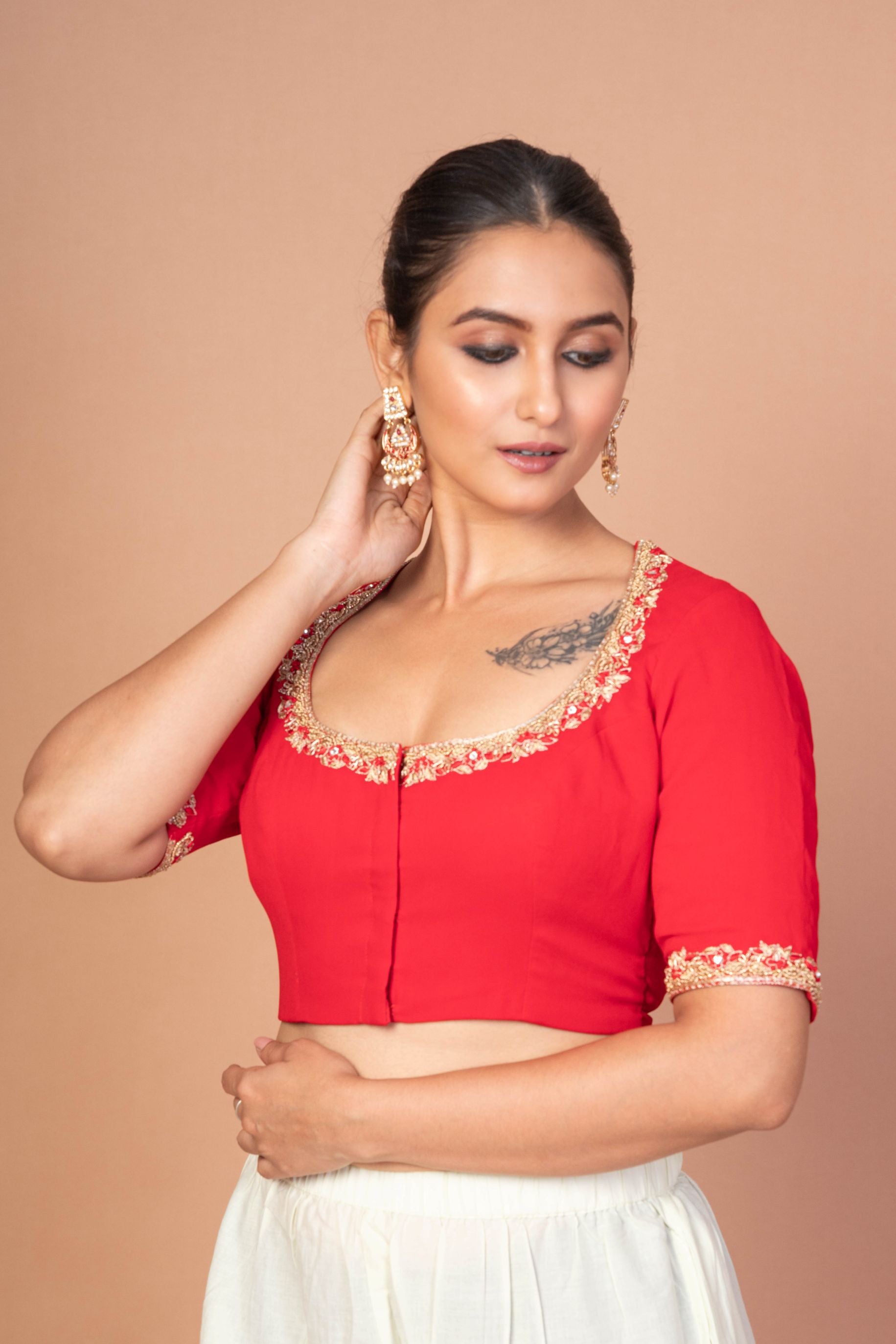 Red Hand-Embroidered Blouse with Round Neck and Back Closure
img 3