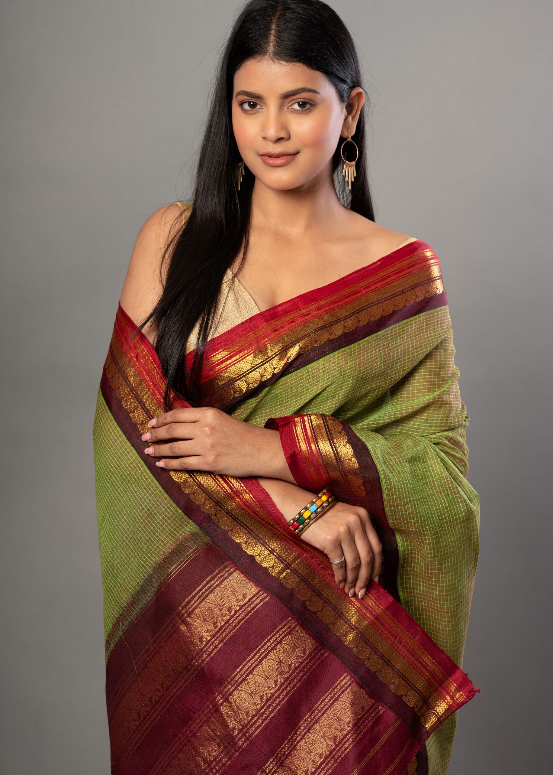 Green and Maroon Pure Cotton Gadwal Saree Close Up
