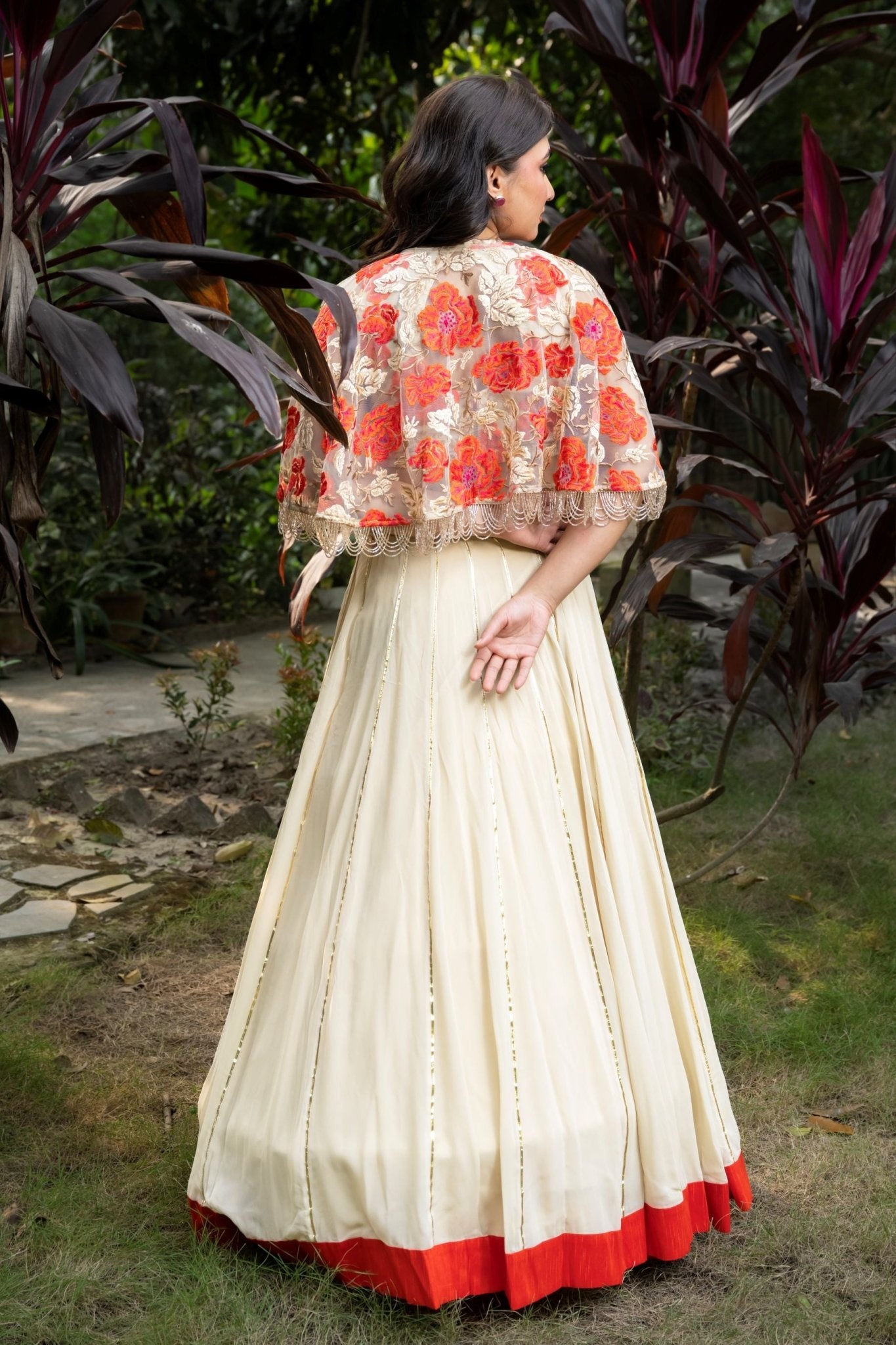 Ivory and Orange Floral Lehenga with Hand - Embroidered Cape - Anvi Couture