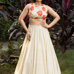 Ivory and Orange Floral Lehenga with Hand - Embroidered Cape - Anvi Couture