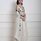 Ivory cape lehenga in tissue silk — side profile showing hand-embroidered bodice detail