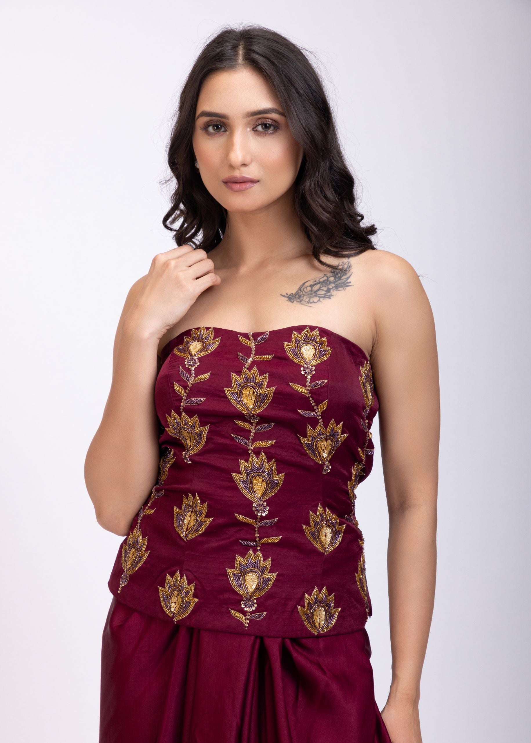Maroon Off Shoulder Corset top with Gold Cutdana Detailing and Drape Skirt close up