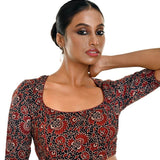Close-up of handcrafted maroon and black Ajrakh print pure cotton saree blouse with ethnic design