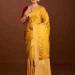 Mustard Yellow Mashru Silk Banarasi Saree with Gold Zari Work and Floral Motifs – Front View – Anvi Couture
