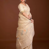 Off-white organza saree — side view showing printed floral embroidery and lace trim along border